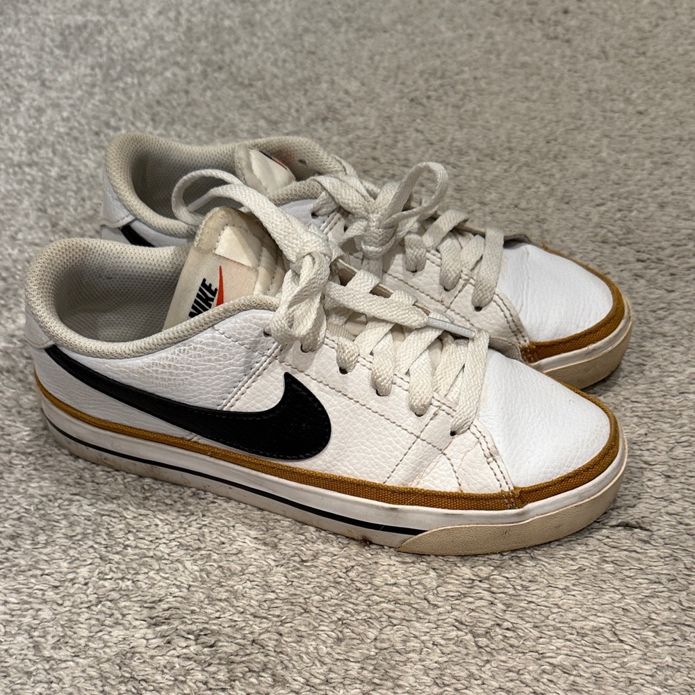 Nike White Sneakers with Black and Gold Details